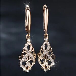 Vintage palace style drop earrings. Covered with Zircon stones 1.6“ x .4”. NIP